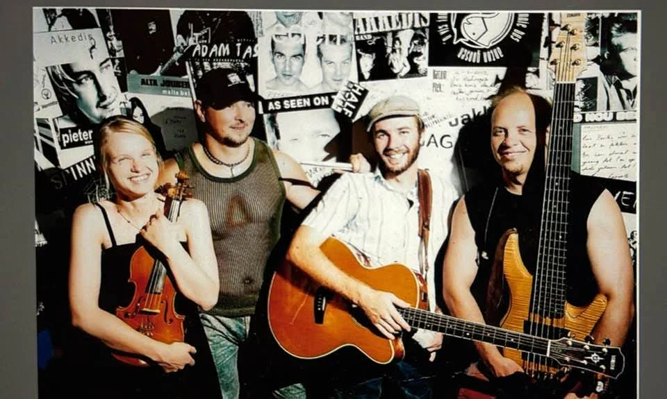 Lowell Jeffery band portrait with violin, acoustic guitar and bass guitar